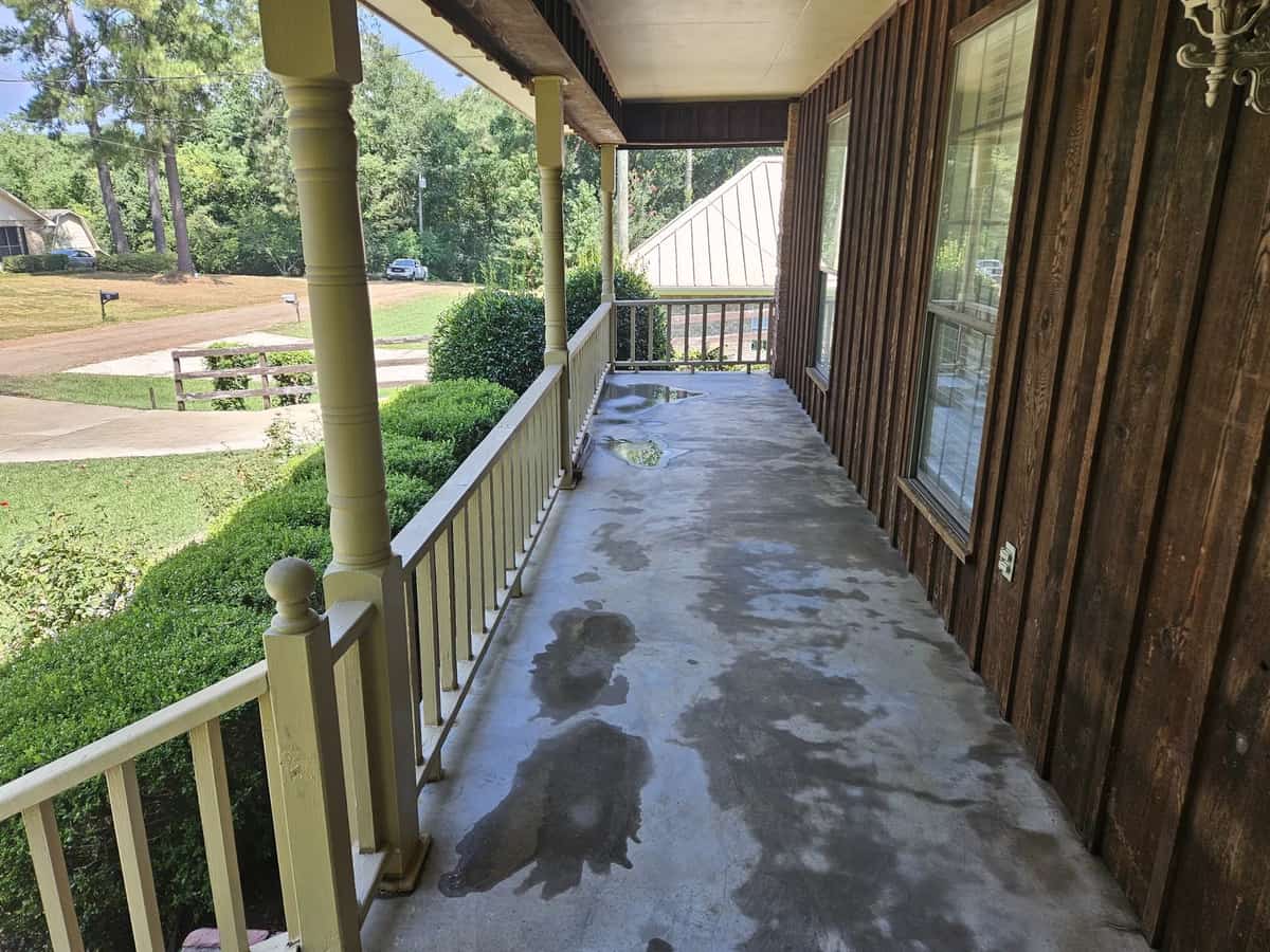 Cleaned covered porch and brick exterior at a Collins home