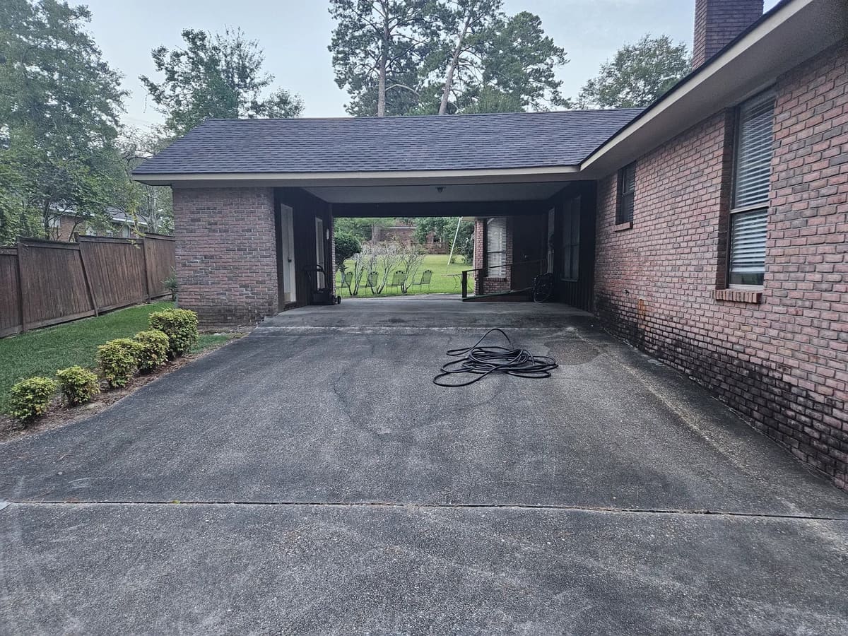 Covered carport before exterior cleaning in Collins, Mississippi