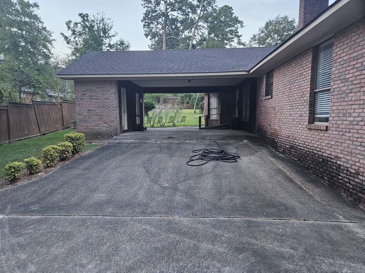 Covered carport before cleaning at a Collins, Mississippi home
