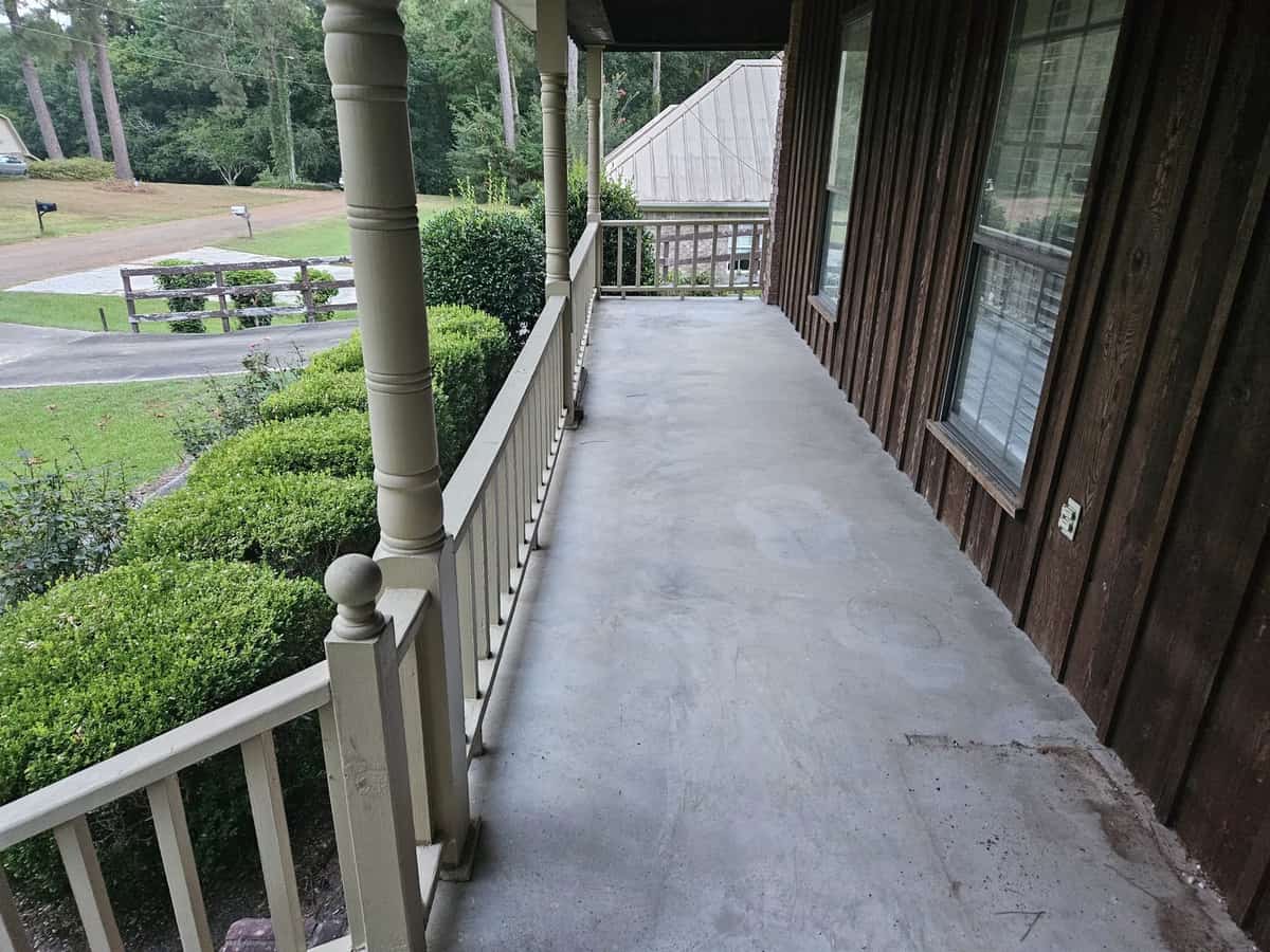 Covered porch before exterior cleaning at a Collins home