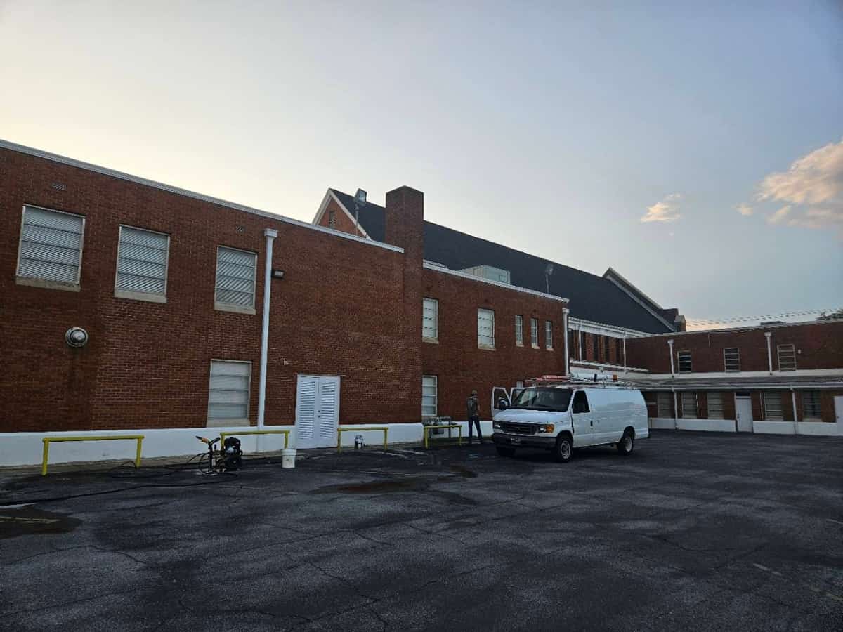 South Mississippi Power Washing van and cleaning equipment beside a brick building in Laurel