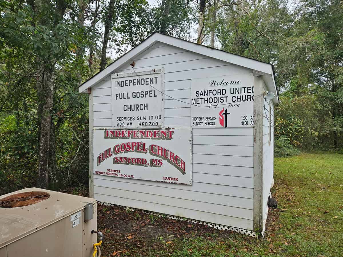 Cleaned painted wall around the same existing church signs in Sanford