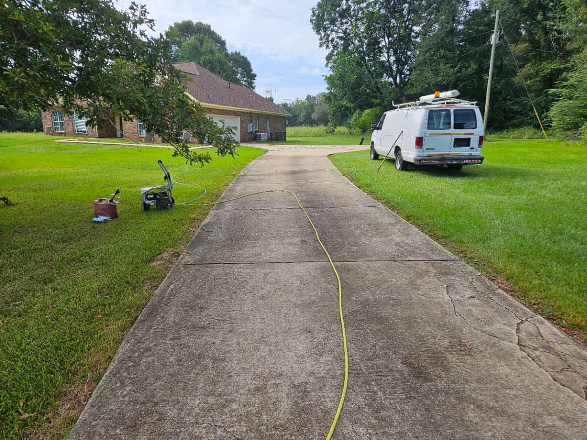 Residential concrete driveway before cleaning in Magee, Mississippi